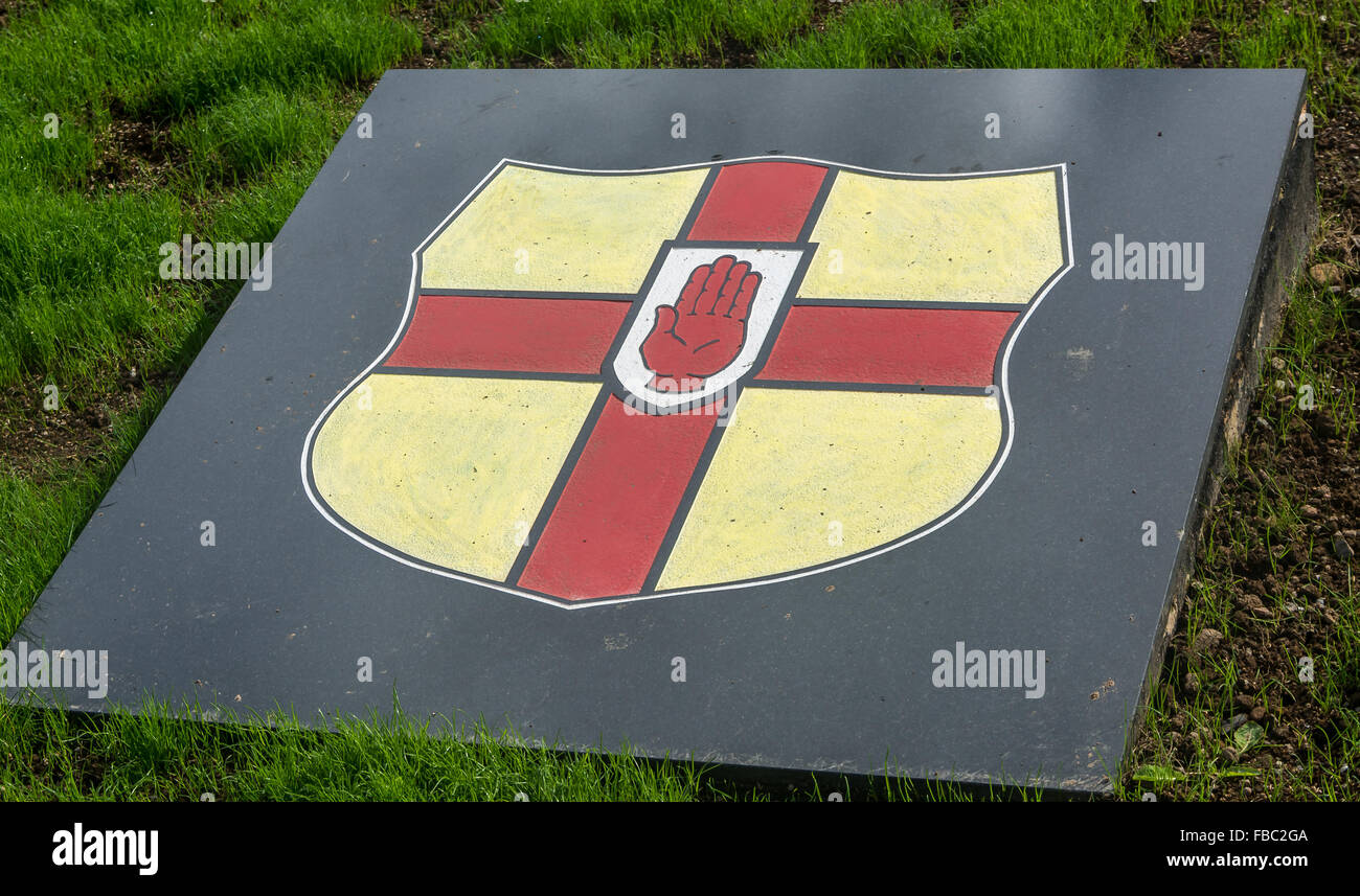The Ulster province crest on stonework in an IRA memorial garden in St. James area of Belfast Stock Photo
