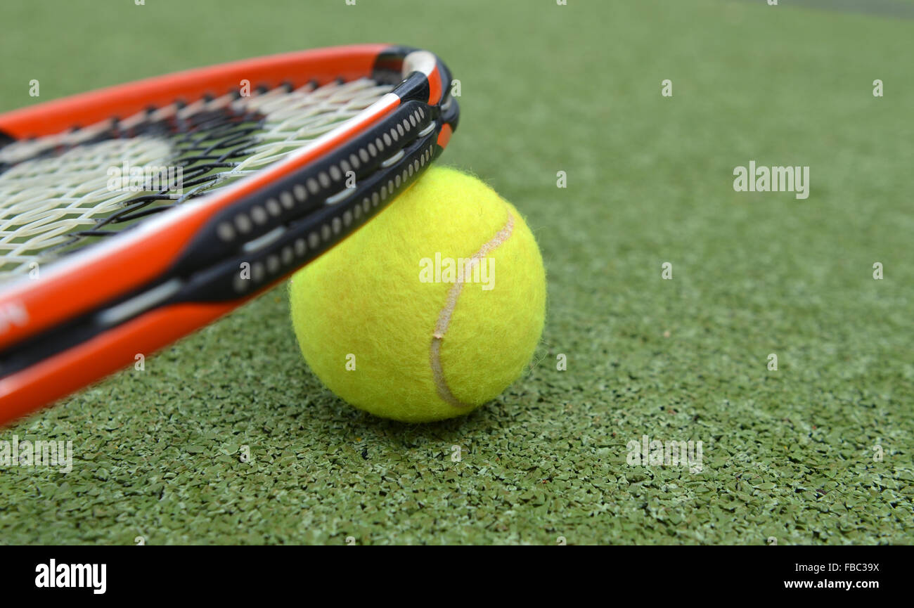 Tennis racket and ball on a tennis court Stock Photo Alamy