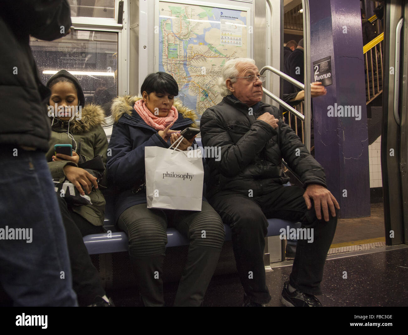 Riders on a New York City subway train on the No. 6 Lexington line in Manhattan. Stock Photo