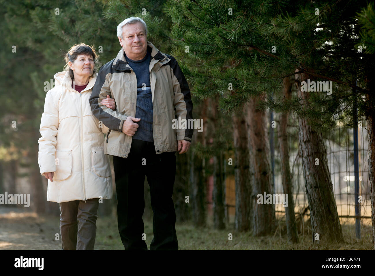 Senior woman walking in park hi-res stock photography and images - Alamy