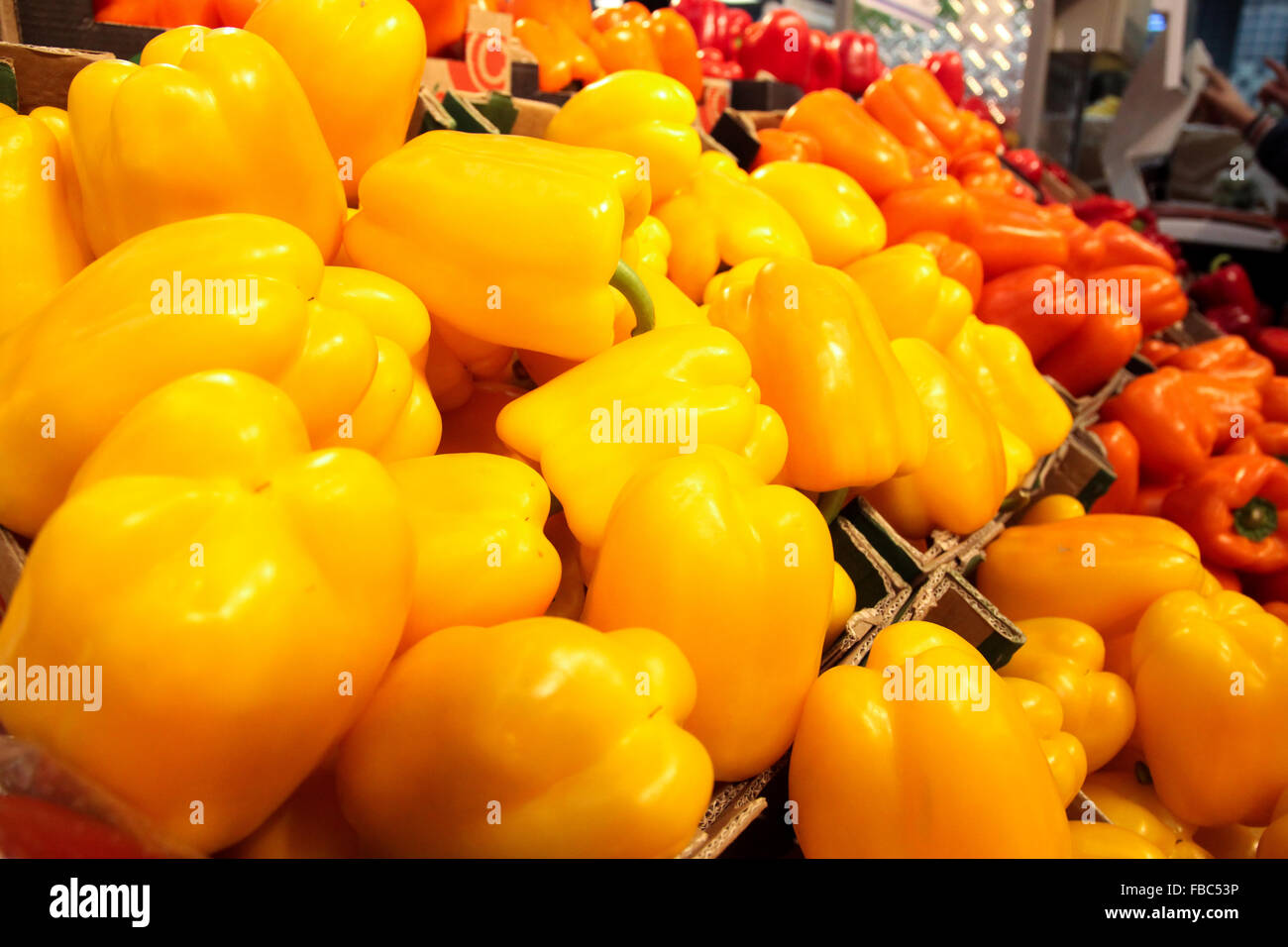 Crates with orange and red peppers at market Stock Photo - Alamy