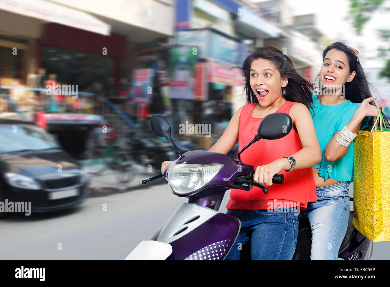 girls riding scooty