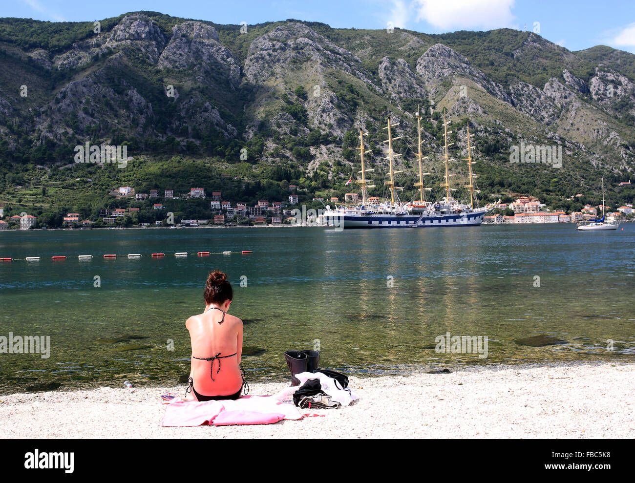 Tall ship seen from the beach of Kotor, Montenegró Stock Photo