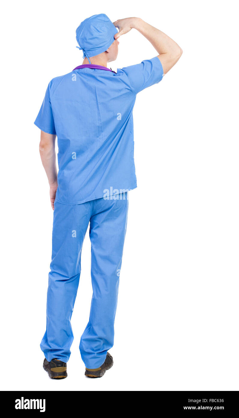 Back view of doctor in robe. Standing young guy. Rear view people collection.  backside view of person.  Isolated Stock Photo