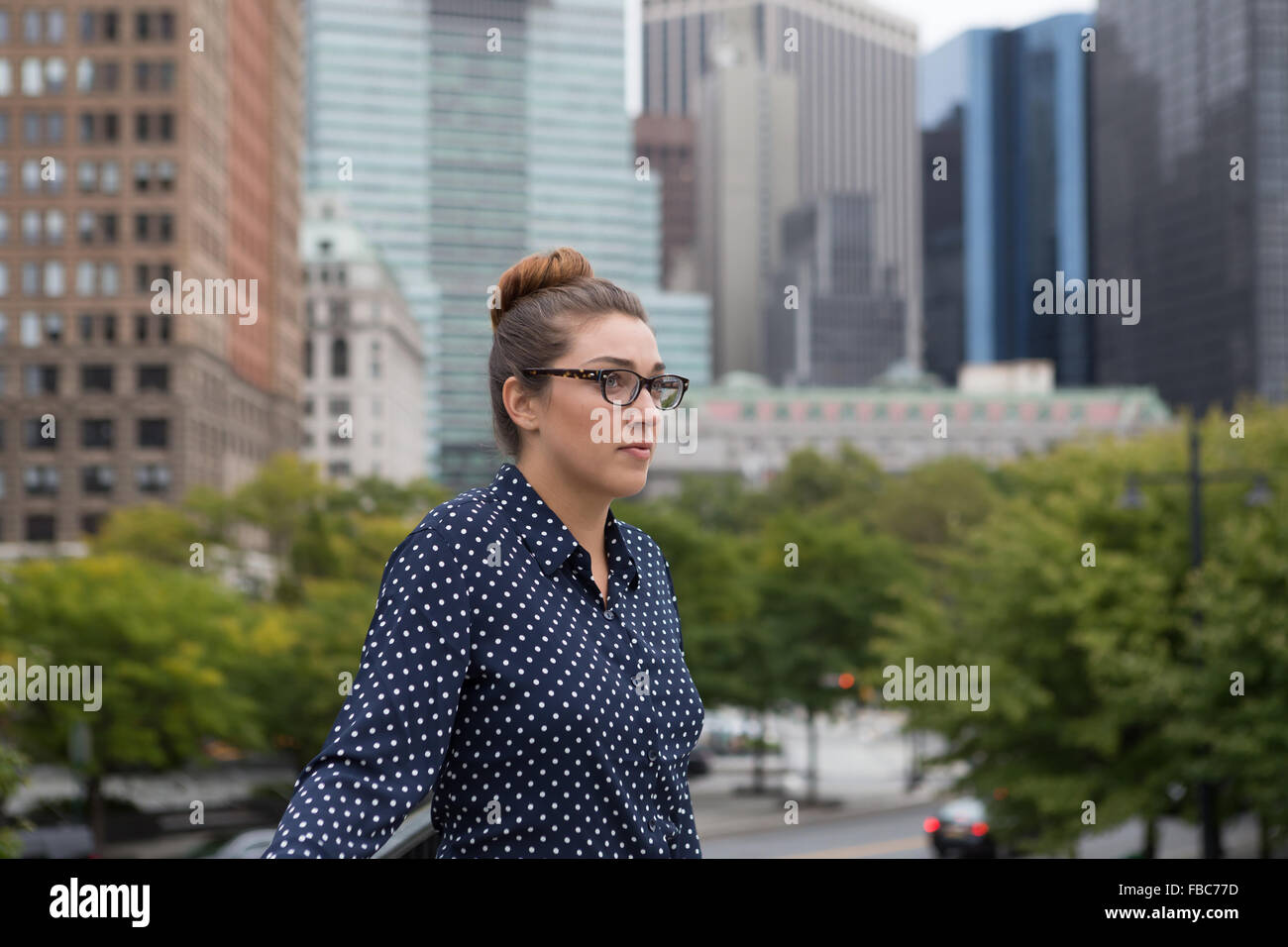 Young professional woman in the city. Photographed in New York City in October 2015. Stock Photo