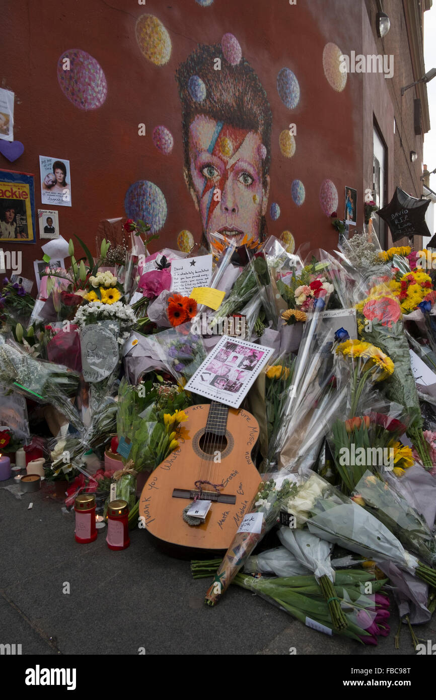 London, UK. 13th Jan, 2016. Fans pay tribute to David Bowie at a mural in Brixton where he was born. Jimmy C Graffiti. David Bowie  died of cancer at the age of 69 on January 10th 2016.13/01/16 Credit:  claire doherty/Alamy Live News Stock Photo