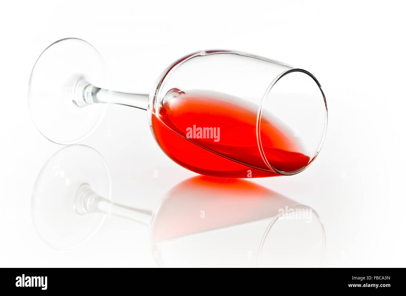 Red Wine spill on a white background Stock Photo