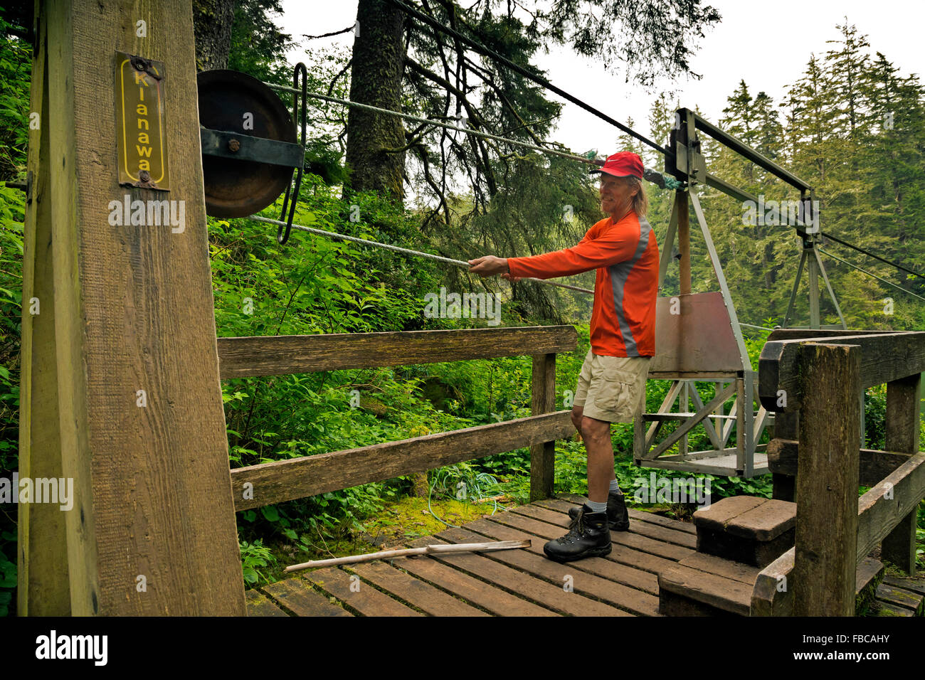 BRITISH COLUMBIA West Coast Trail hiker pulling up a cable car for a