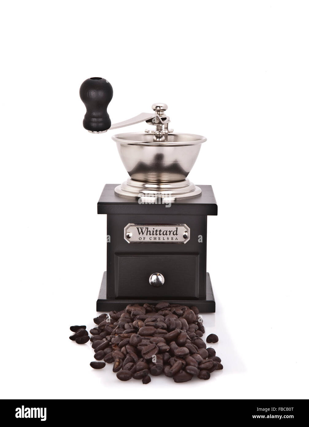 Whittards Coffee Grinder with coffee beans on a white background Stock Photo