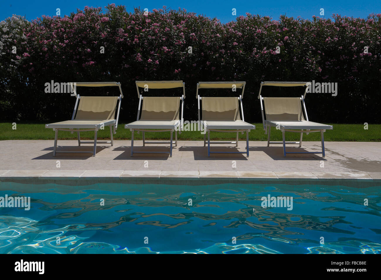 Swimming pool in open air and relax seats Stock Photo Alamy