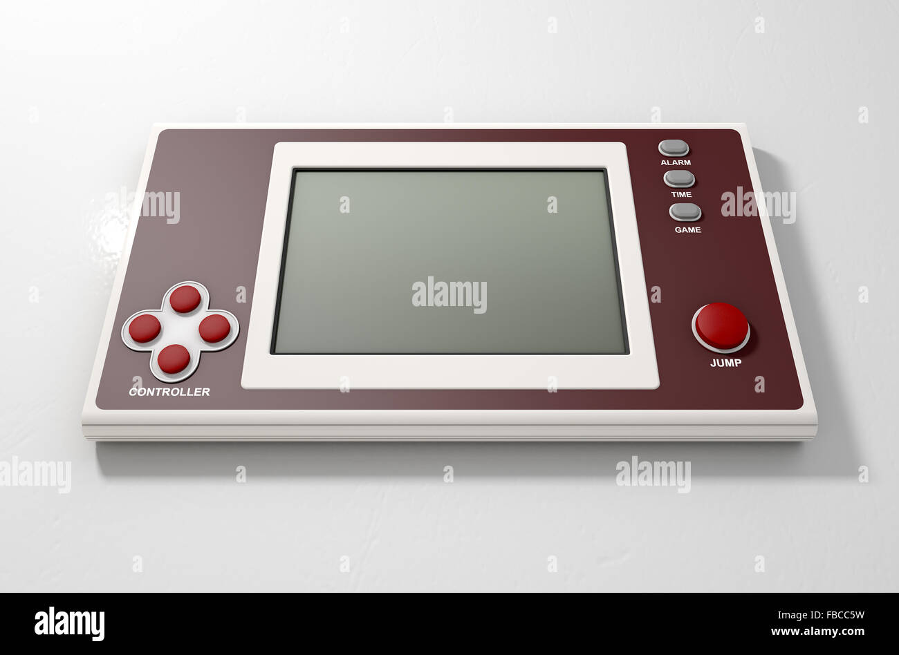 A vintage handheld video game console with a blank screen on an isolated white background Stock Photo