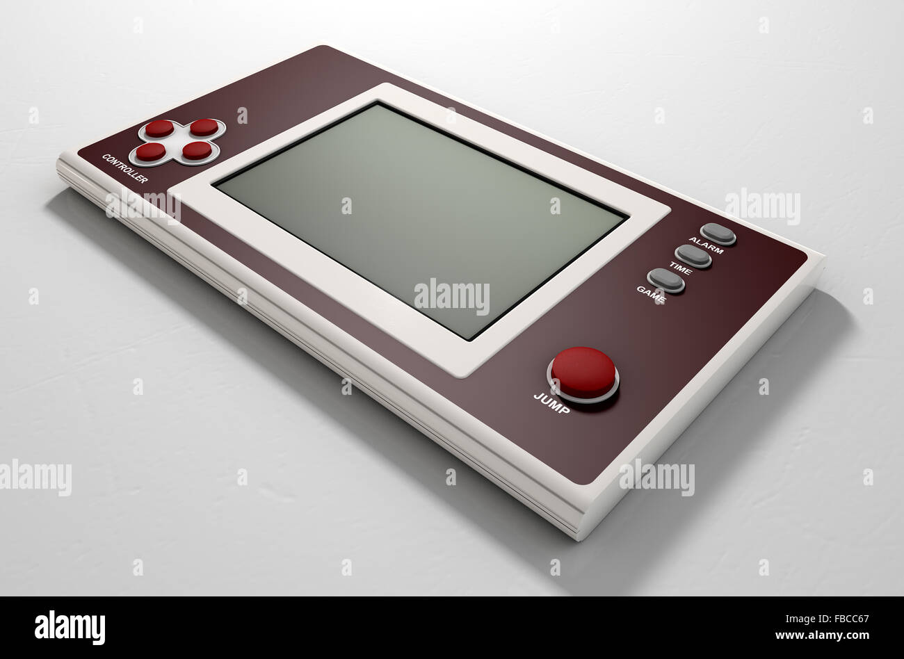 A vintage handheld video game console with a blank screen on an isolated white background Stock Photo