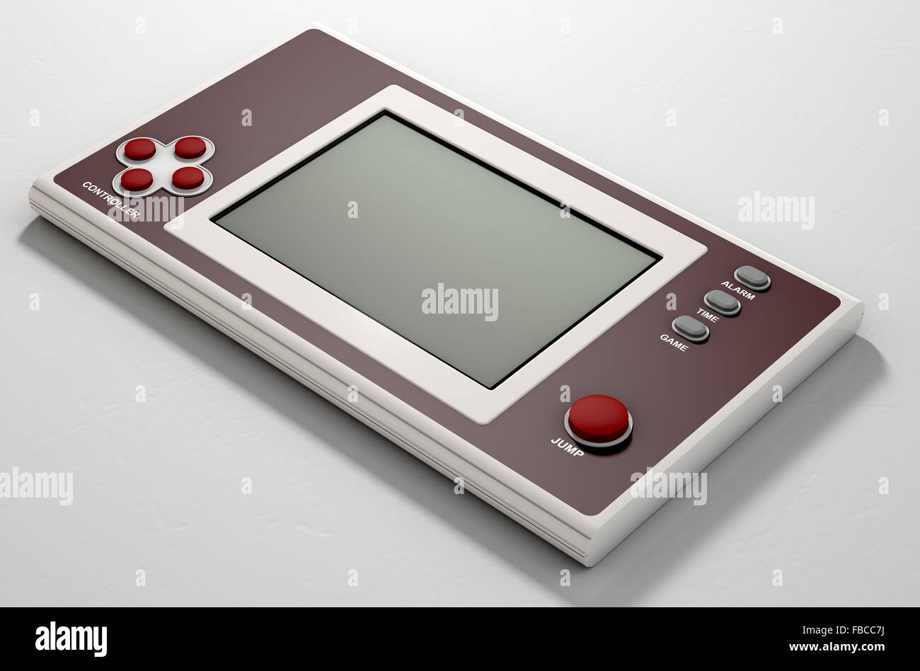 A vintage handheld video game console with a blank screen on an isolated white background Stock Photo