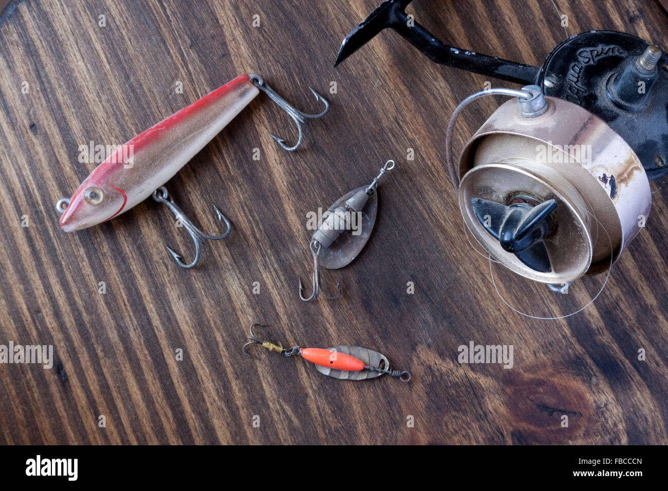 Vintage fishing gear on a vintage type background Stock Photo - Alamy