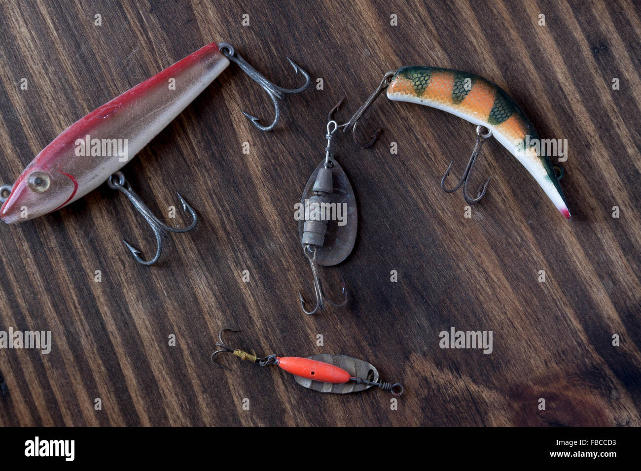 Various vintage fishing hooks on a vintage type background Stock Photo -  Alamy