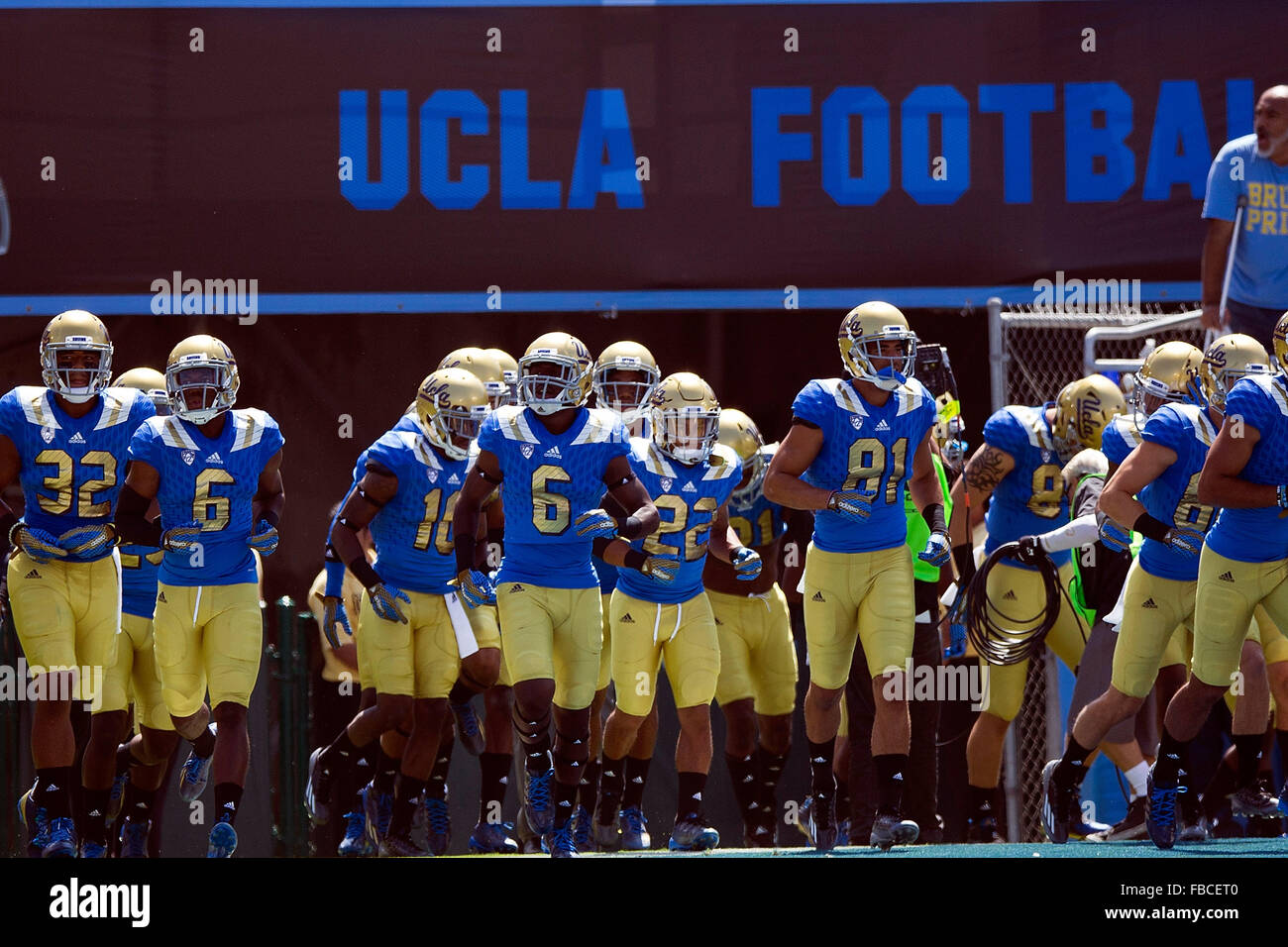 The UCLA Bruins football team enters the field before the game against the Virginia Cavaliers at the Rose Bowl on September 5, Stock Photo