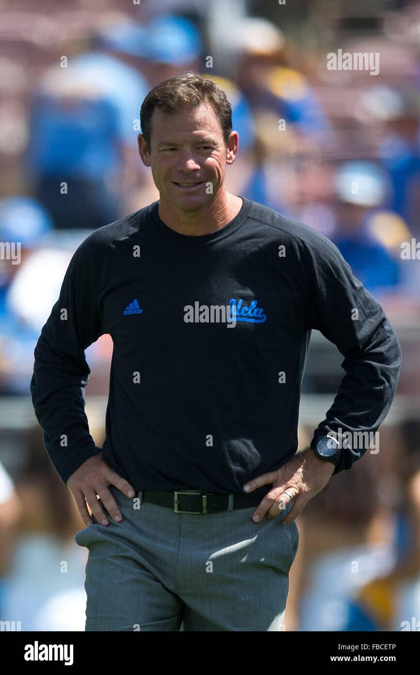 Head coach Jim Mora  of the UCLA Bruins stands on the field before the game against the Virginia Cavaliers at the Rose Bowl on Stock Photo