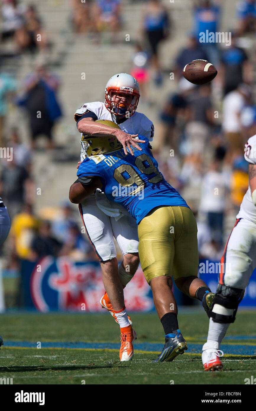 Adult football player throwing ball hires stock photography and images