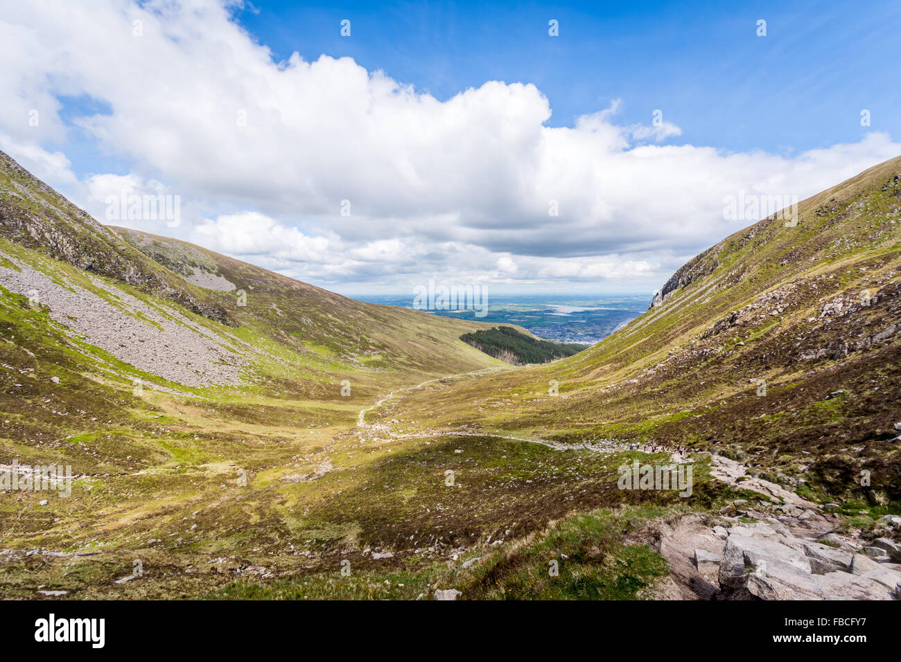 A rocky path leading down to Newcastle from Slieve Donard in Ireland. Stock Photo