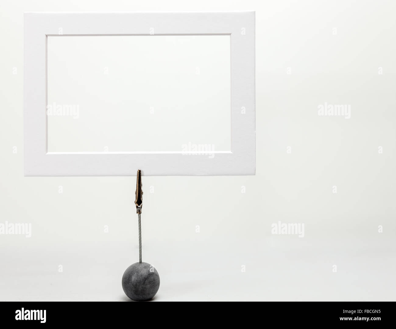 Picture frame on clip stand with empty center, white background Stock