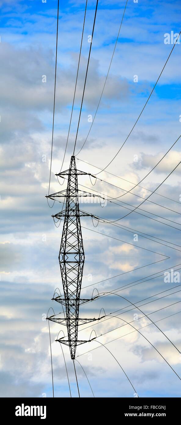 Electricity pylon reflected into a digitally created pool of waterEngland UK Stock Photo