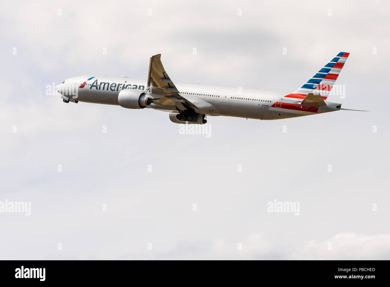 Side view of an American Airlines Boeing 777-300 taking off from London Heathrow Stock Photo
