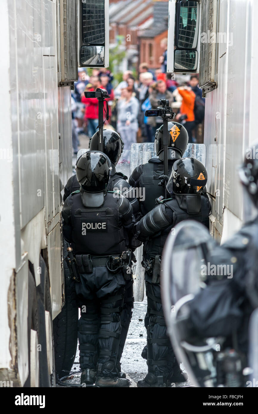 PSNI police officers gather intelligence during Belfast riot. Stock Photo