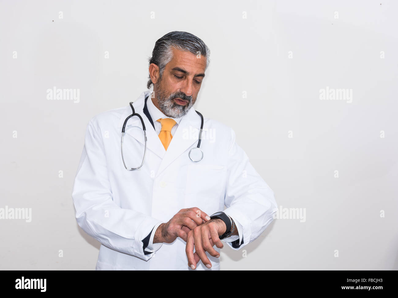 Doctor uses the smartwacth. Even doctors and medicals, like other professionals, using new technologies such as smartwacth, Stock Photo