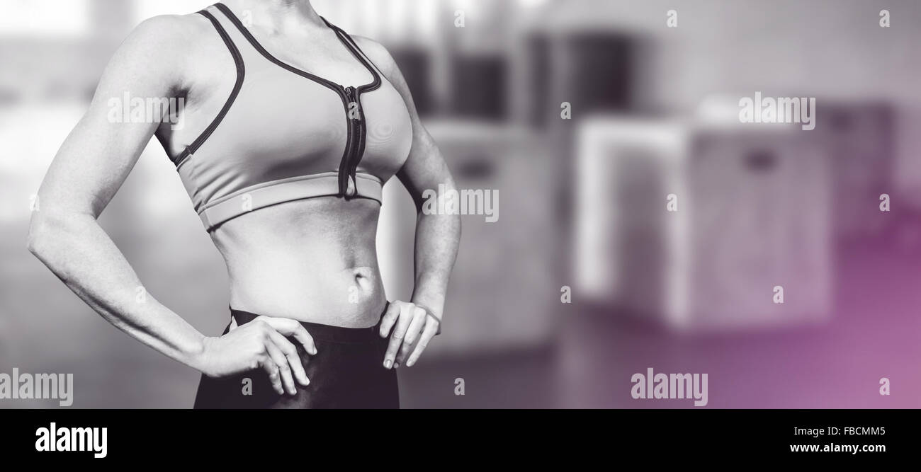 Composite image of midsection of woman with hand on hip Stock Photo