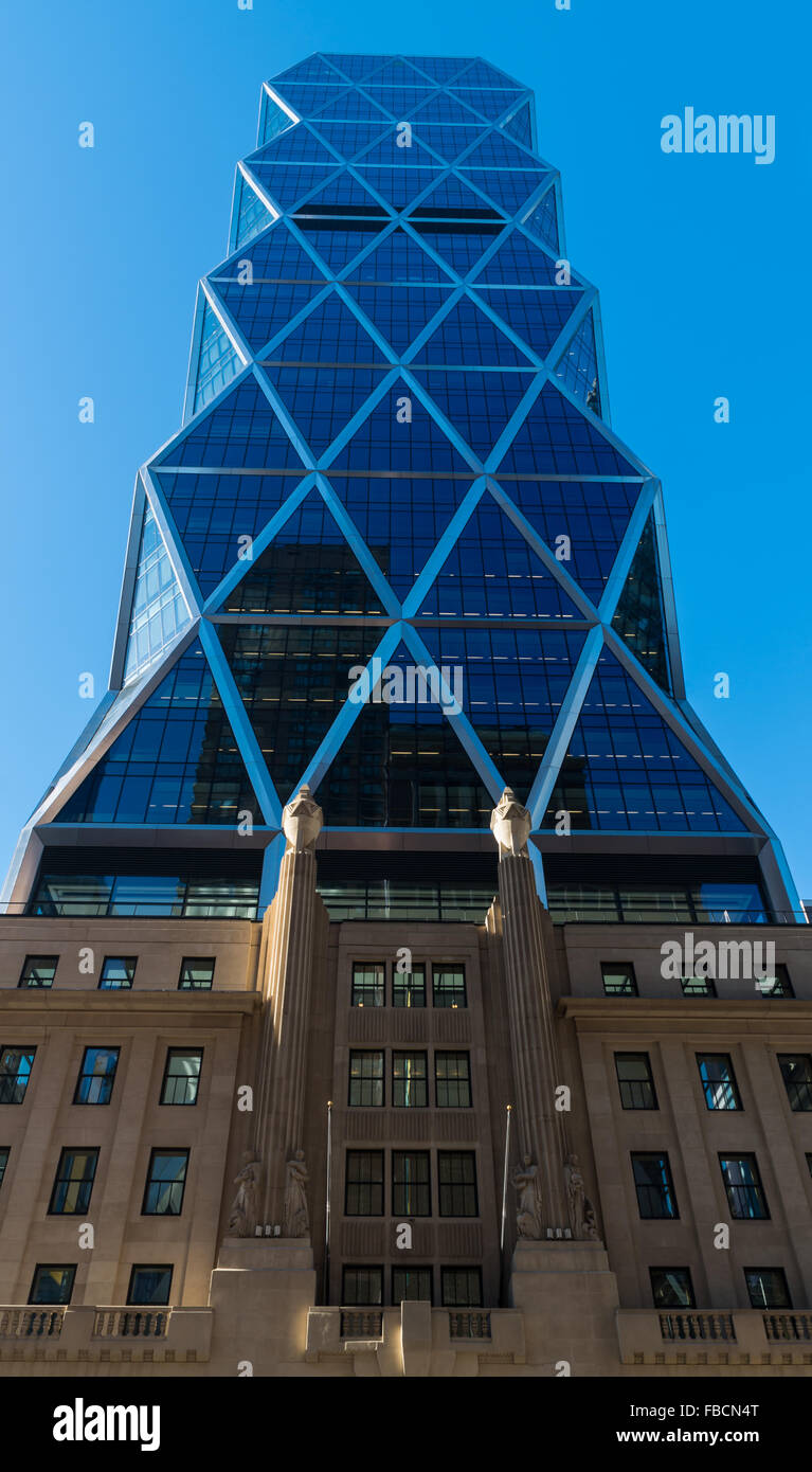 The Hearst Tower on 8th Avenue in New York City with original art deco architecture and a modern add on tower. Stock Photo