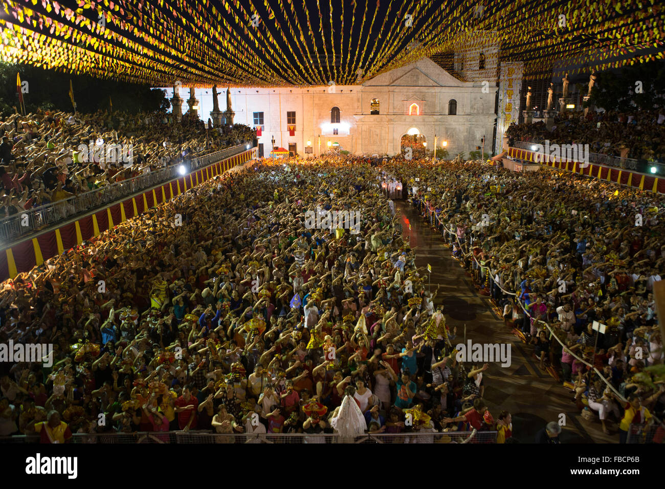 Cebu City, Philippines. 15th January, 2016. ‘Walk with Mary’, a foot penitential procession starting at 4:30 am where thousands of Filipino Catholics flock to the oldest Roman Catholic Church in the Philippines - the Basilica Minore del St.Nino in Cebu City. The religious event is part of Sinulog (Fiesta Señor) - a nine day religious festival honouring the Santo Nino De Cebu (Holy Child of Cebu). Many devotees bring with them a Santo Nino figurine representing the Child Jesus. Credit:  imagegallery2/Alamy Live News Stock Photo