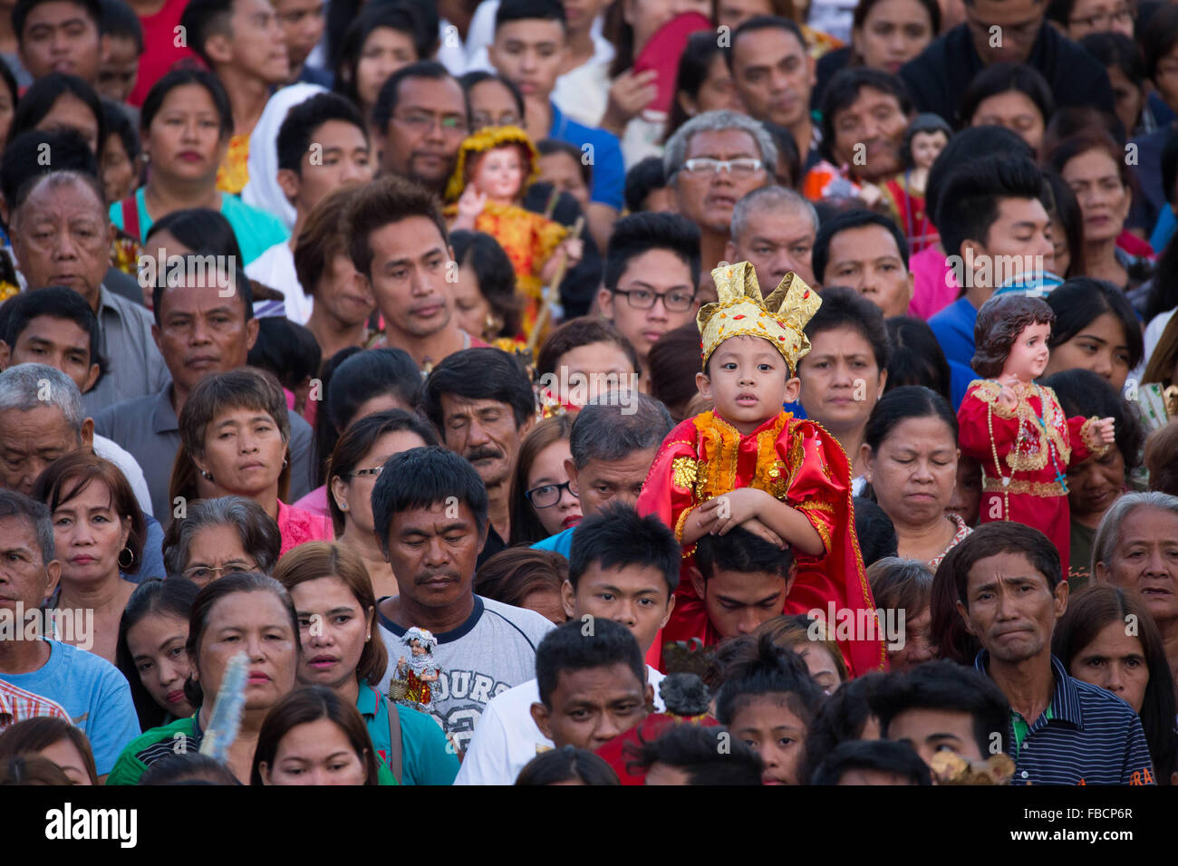 Cebu City, Philippines. 15th January, 2016. ‘Walk with Mary’, a foot penitential procession starting at 4:30 am where thousands of Filipino Catholics flock to the oldest Roman Catholic Church in the Philippines - the Basilica Minore del St.Nino in Cebu City. The religious event is part of Sinulog (Fiesta Señor) - a nine day religious festival honouring the Santo Nino De Cebu (Holy Child of Cebu). Many devotees bring with them a Santo Nino figurine representing the Child Jesus. Credit:  imagegallery2/Alamy Live News Stock Photo