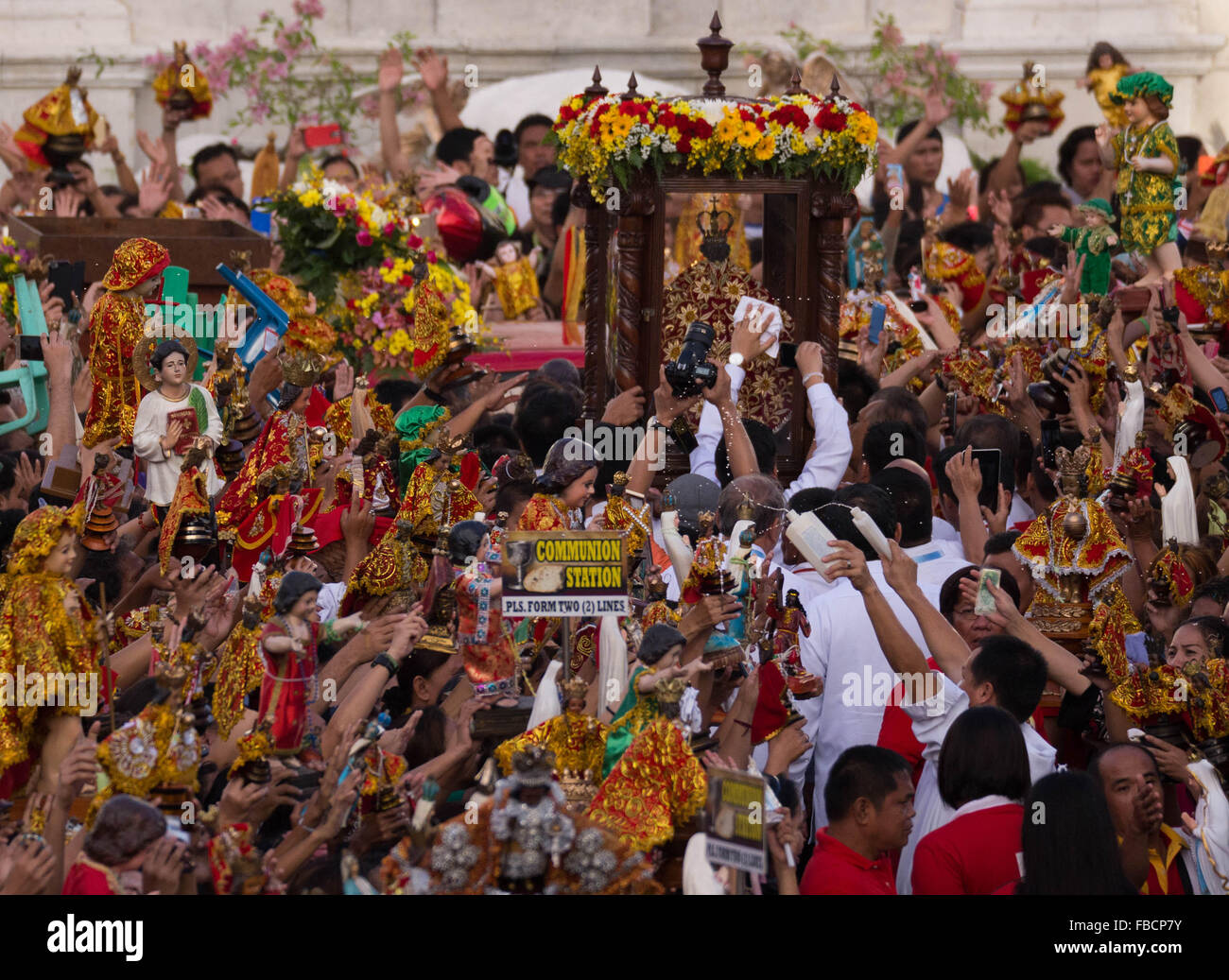 Cebu City, Philippines. 15th January, 2016. ‘Walk with Mary’, a foot penitential procession starting at 4:30 am where thousands of Filipino Catholics flock to the oldest Roman Catholic Church in the Philippines - the Basilica Minore del St.Nino in Cebu City. The religious event is part of Sinulog (Fiesta Señor) - a nine day religious festival honouring the Santo Nino De Cebu (Holy Child of Cebu). Many devotees bring with them a Santo Nino figurine representing the Child Jesus. Credit:  imagegallery2/Alamy Live News Stock Photo