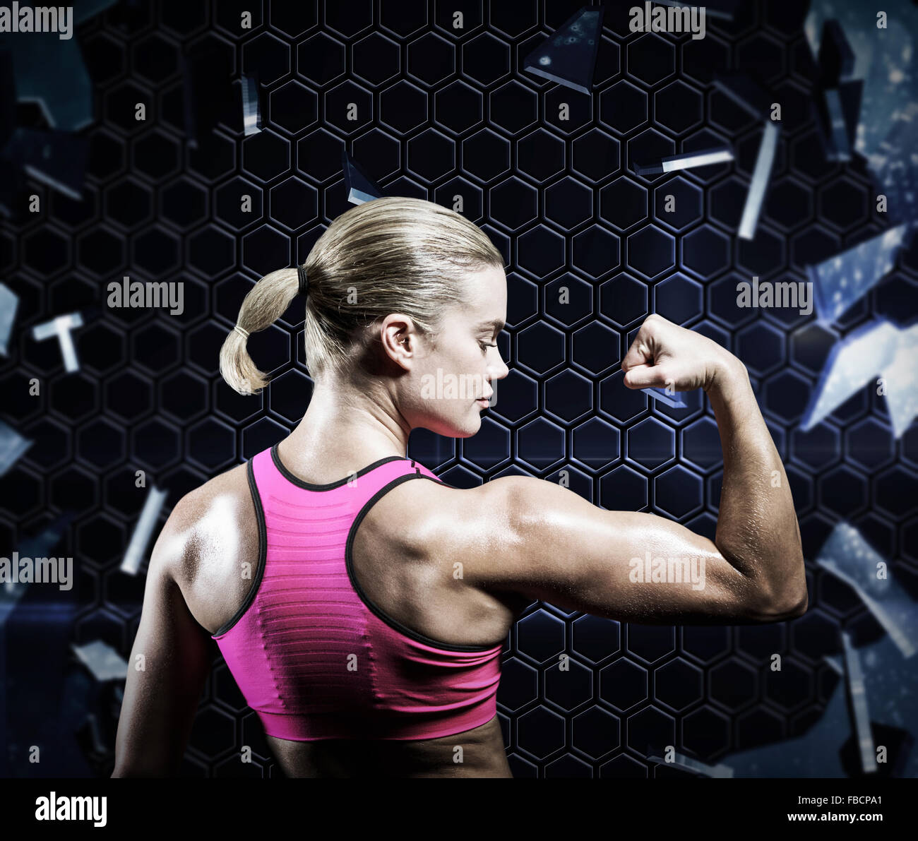 Composite image of muscular woman flexing her arm Stock Photo