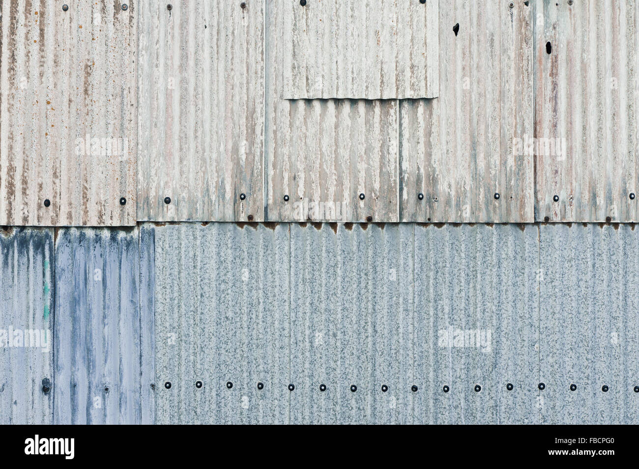 Rusty metal sheets on the wall of a building Stock Photo - Alamy