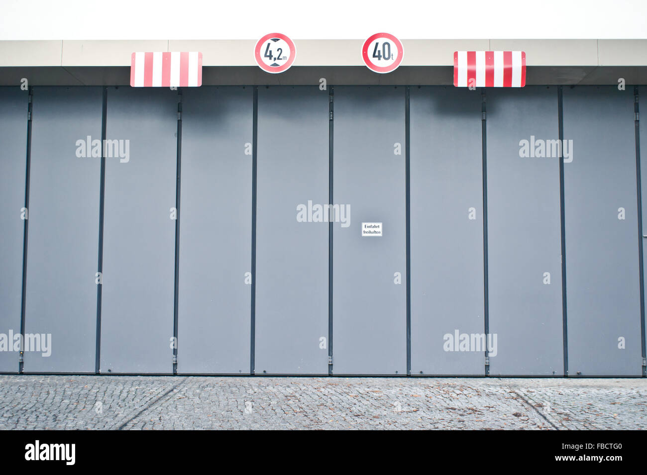 Height and weight limit warning sings at the entrance to a warehouse Stock Photo