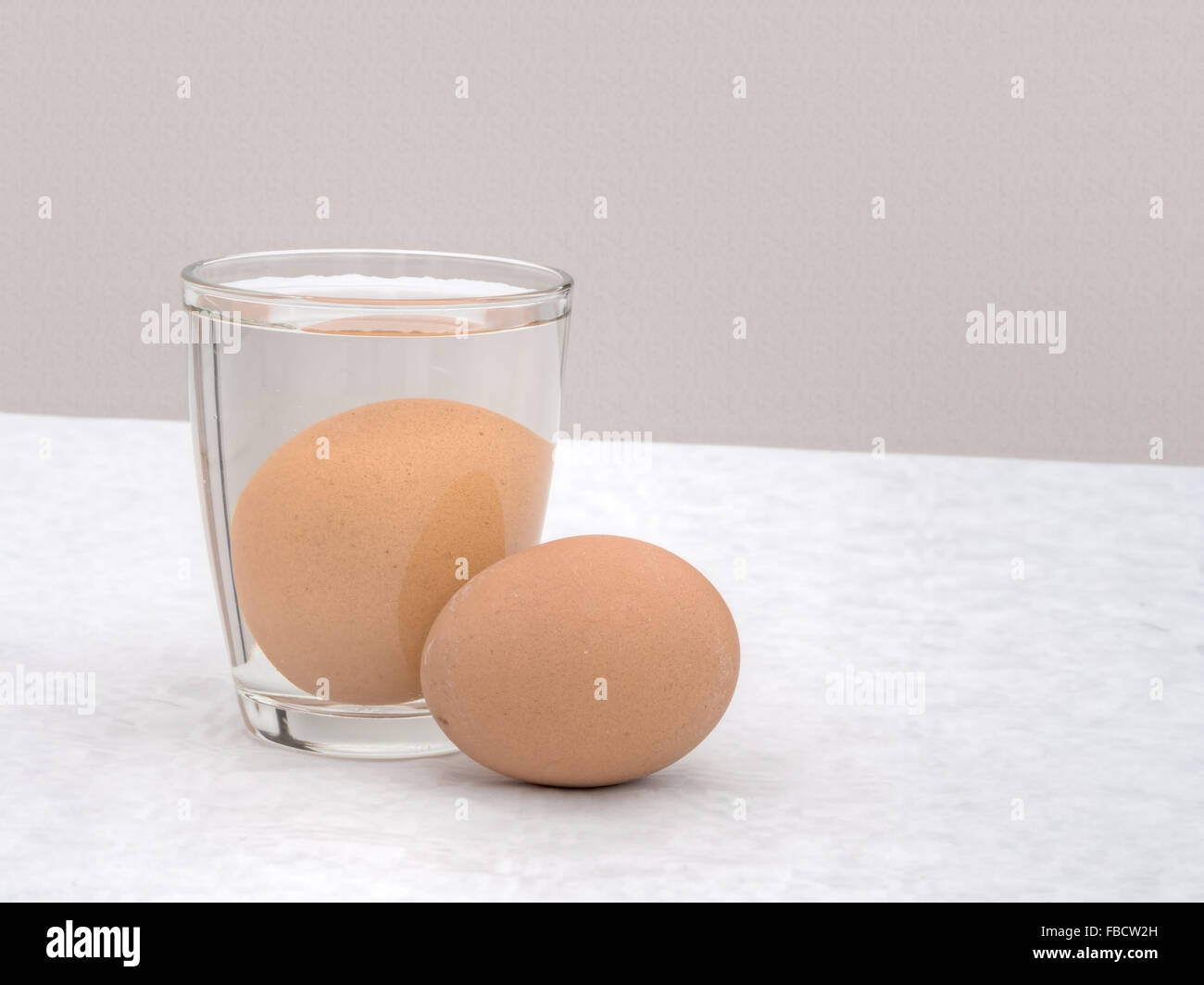 Testing for a good egg. Sunk in water. Traditional way to tell. Stock Photo