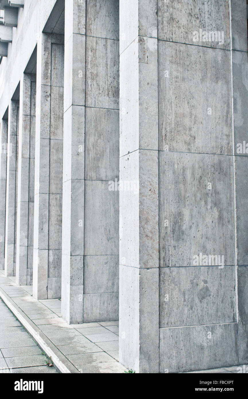 Large concrete pillars at the base of an urban building Stock Photo