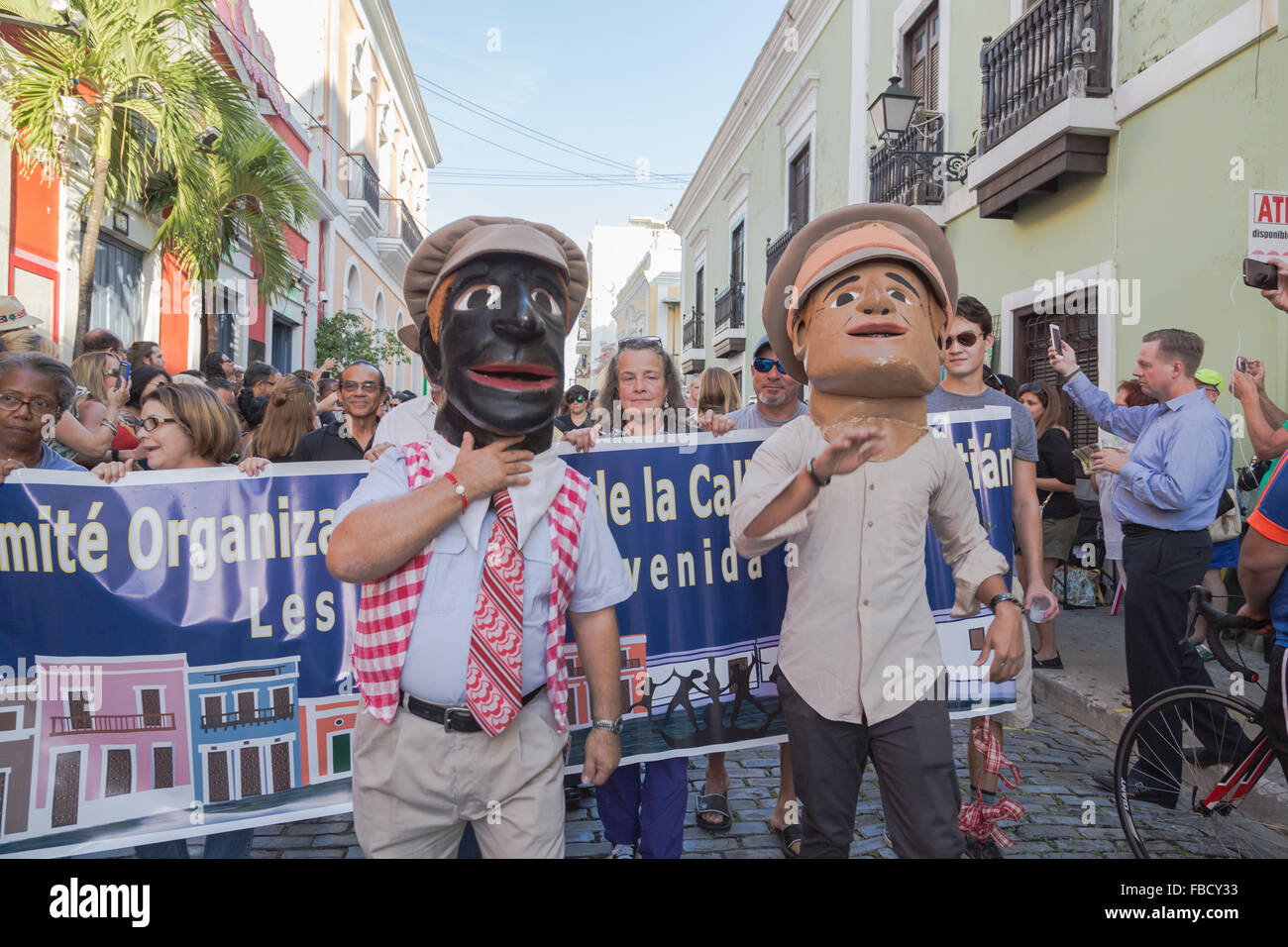 San Juan, Puerto Rico. 14th January, 2016.  Two masked men marches in the street at the San Sebastian Street Festival. Maria S./Alamy Live News Stock Photo