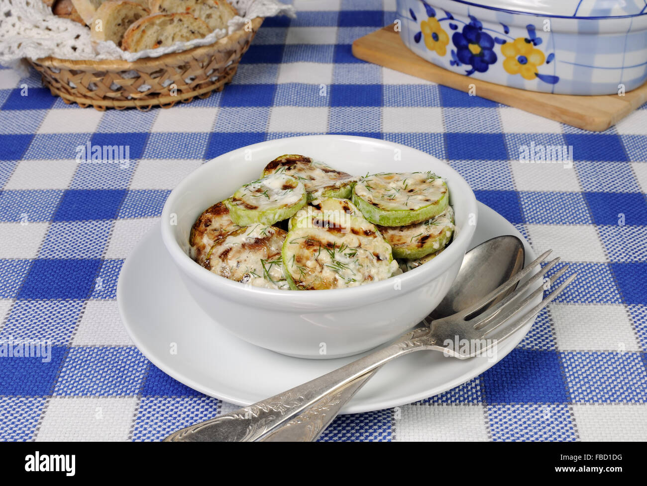Zucchini in cream sauce with dill and garlic Stock Photo Alamy