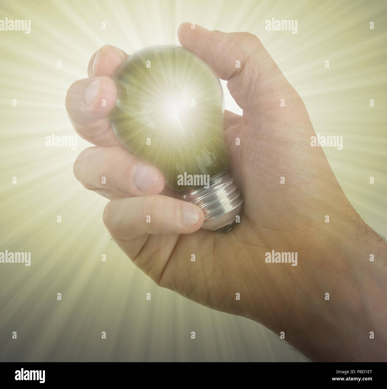 Hand holding an light bulb isolated on white background Stock Photo - Alamy