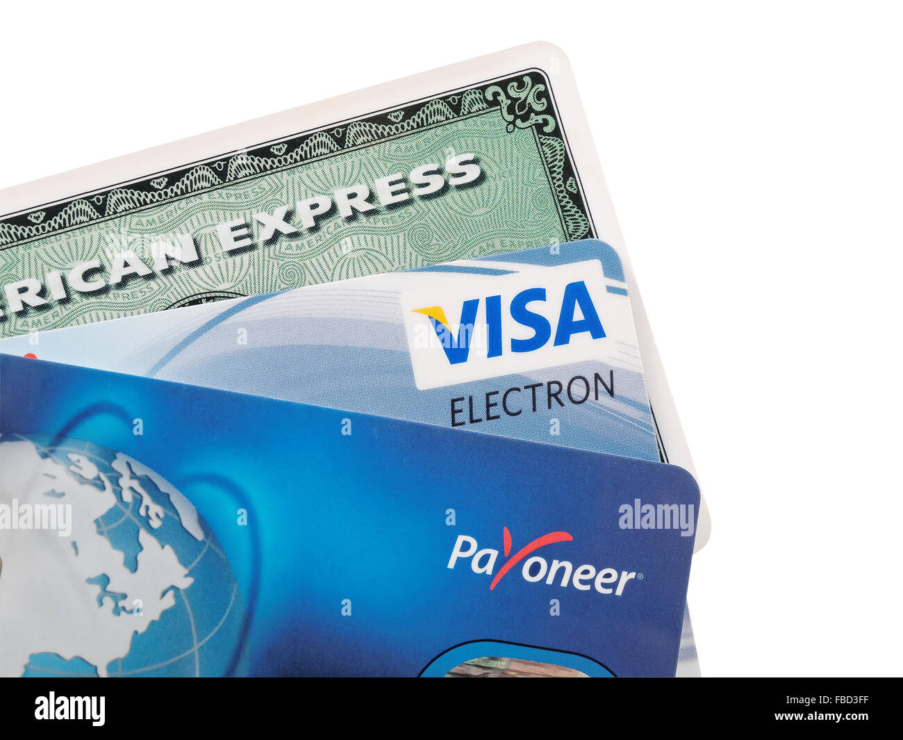 Closeup studio shot of credit cards issued by the three major brands American Express, VISA and Payoneer. Stock Photo