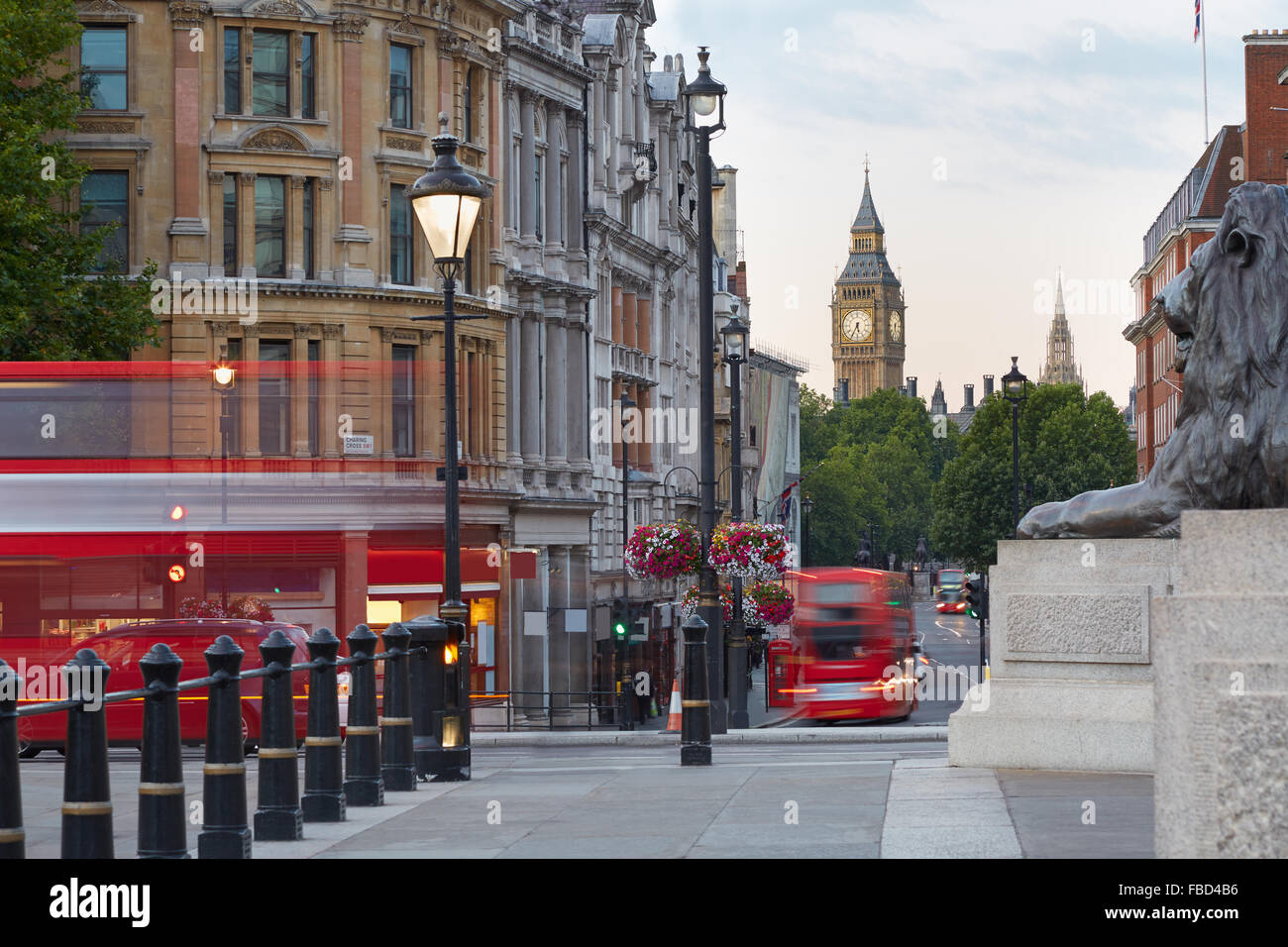Big Ben with red London bus seen from Trafalgar square, morning Stock Photo