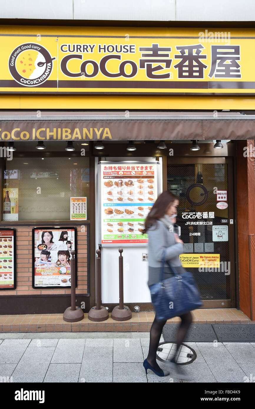 a-pedestrian-walks-past-a-coco-ichibanya-curry-house-restaurant-in