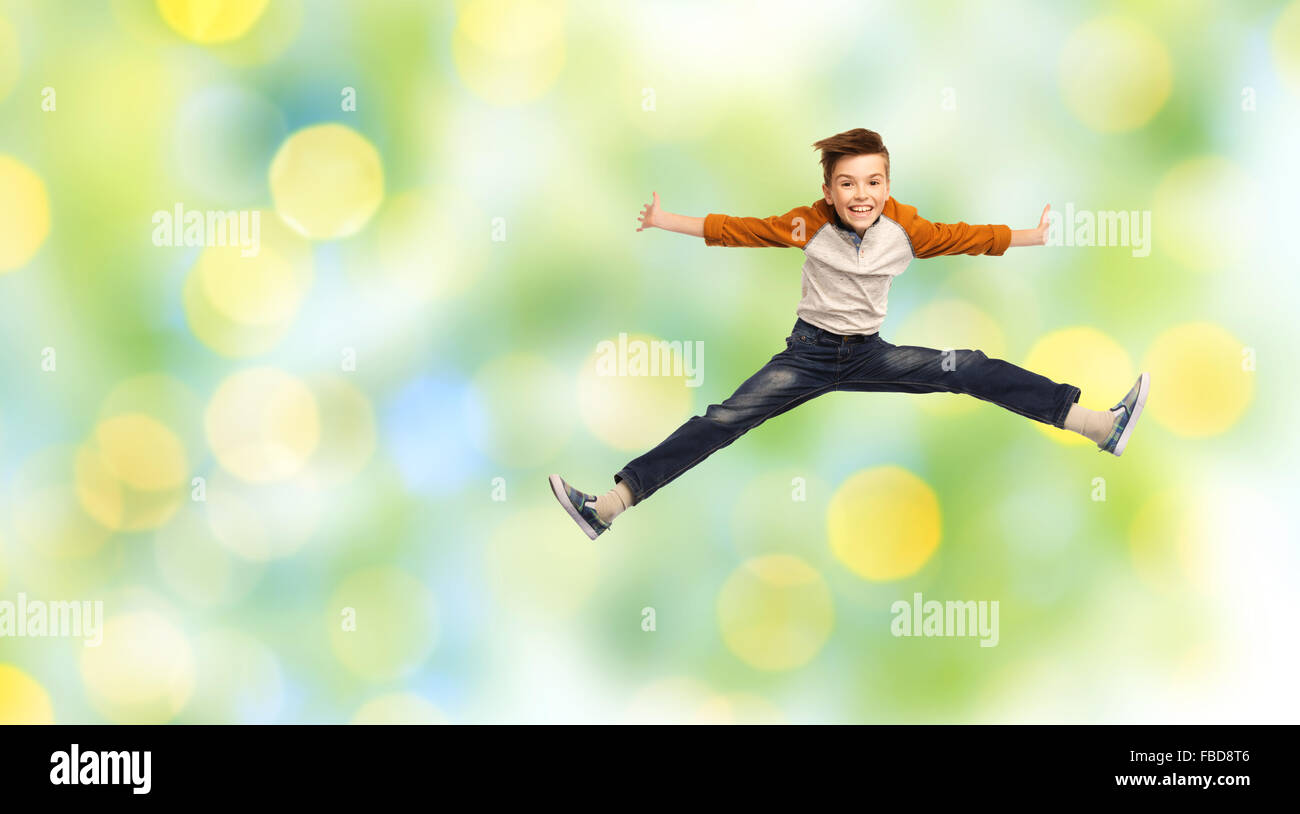 happy smiling boy jumping in air Stock Photo - Alamy