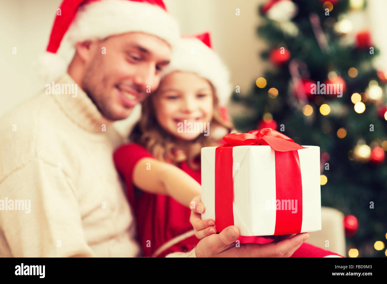 close up of father and daughter with gift box Stock Photo