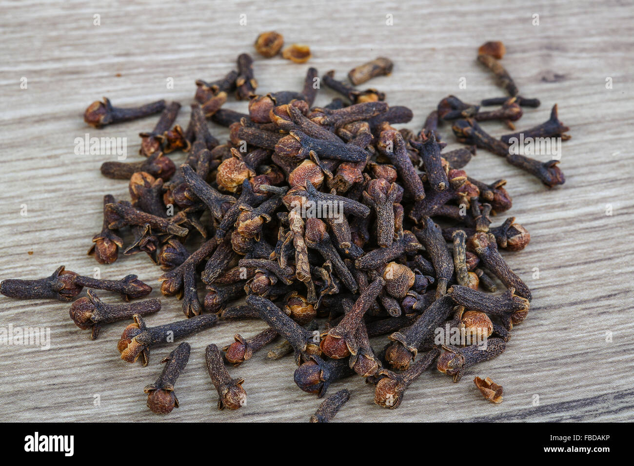 Aromatic Dried Cloves seeds on the wood background Stock Photo - Alamy