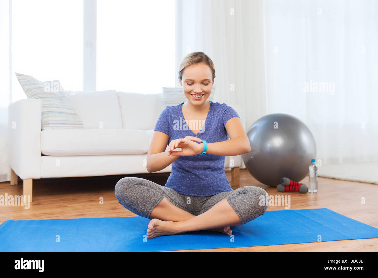 happy woman with heartrate watch exercising Stock Photo Alamy