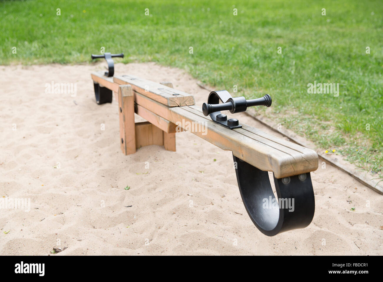 close up of swing or teeterboard on playground Stock Photo