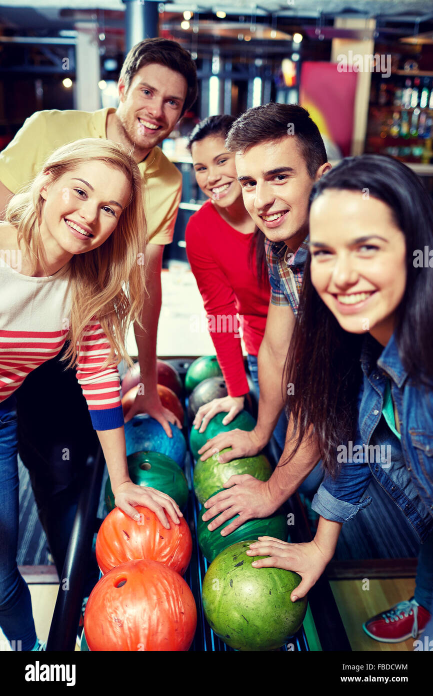 happy friends in bowling club Stock Photo